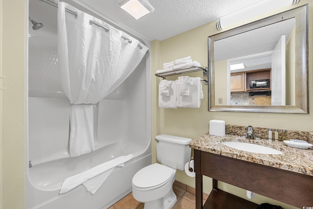 full bathroom with toilet, tile patterned floors, vanity, a textured ceiling, and shower / bathtub combination with curtain