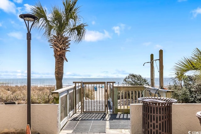 wooden terrace with a water view