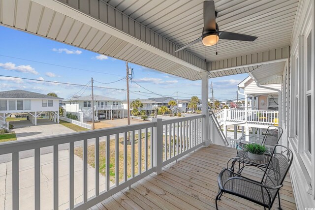 wooden terrace featuring ceiling fan