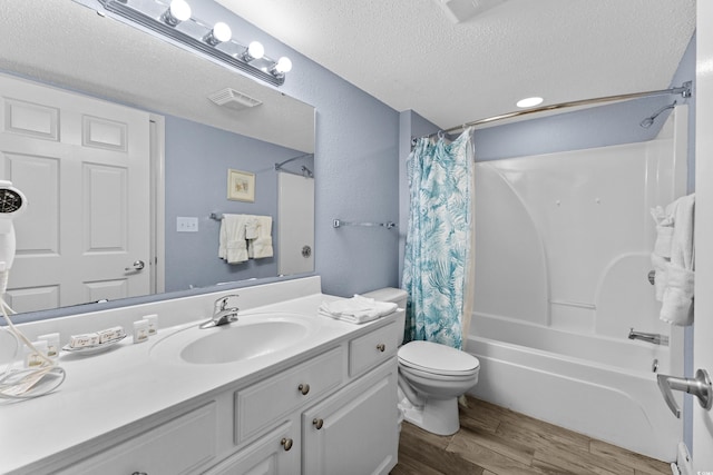 full bathroom with vanity, toilet, a textured ceiling, shower / bathtub combination with curtain, and hardwood / wood-style floors