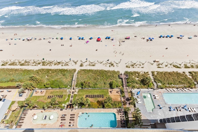 bird's eye view featuring a beach view and a water view