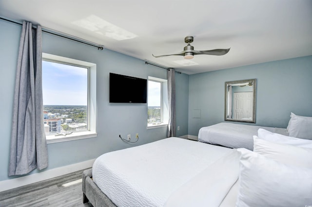 bedroom featuring ceiling fan and wood-type flooring