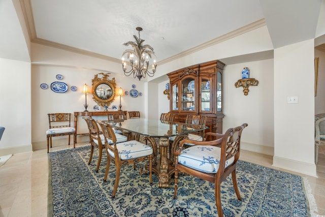 dining room featuring crown molding and a notable chandelier