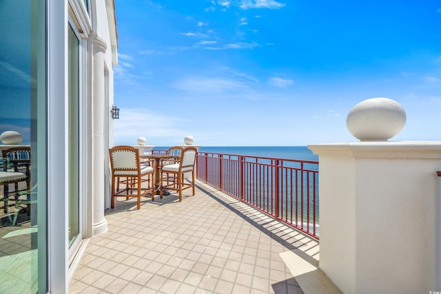 balcony featuring a water view