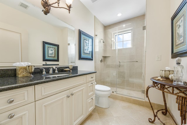 bathroom with an enclosed shower, tile patterned flooring, toilet, and vanity