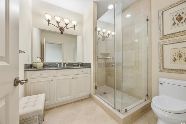 bathroom with tile patterned floors, walk in shower, toilet, and vanity