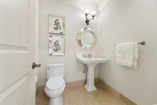 bathroom with toilet and tile patterned floors