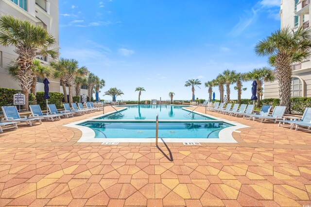 view of swimming pool with a patio area