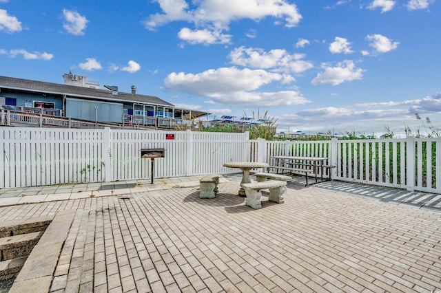 view of patio featuring fence