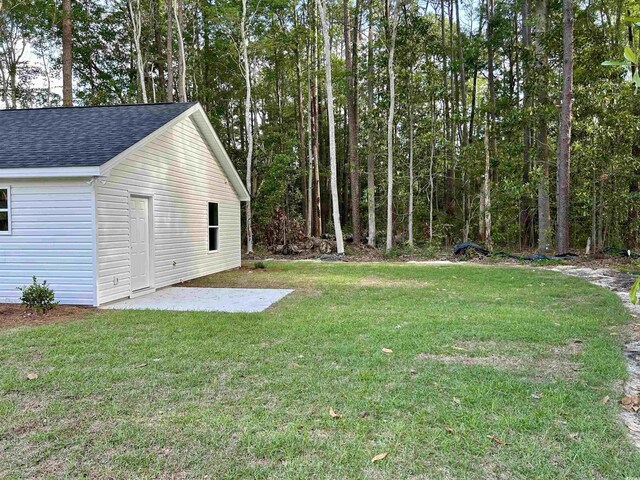 74 Greentown Rd, Georgetown, SC 29440 - view of green lawn with a patio