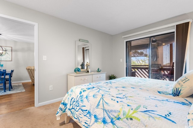 bedroom with light hardwood / wood-style floors and access to exterior