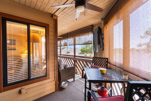 sunroom / solarium featuring ceiling fan and wooden ceiling