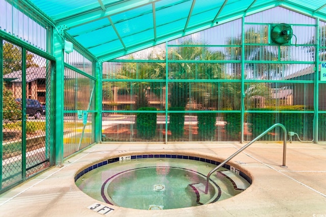 view of pool with an indoor hot tub