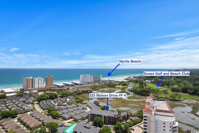 aerial view featuring a water view and a beach view