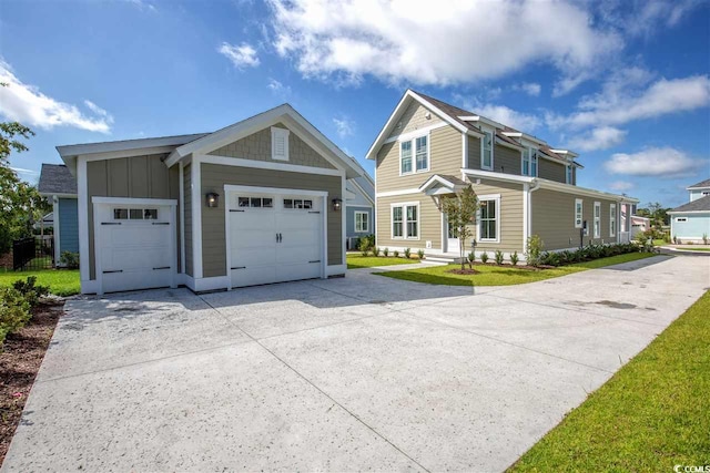 view of front of home with a garage and a front lawn