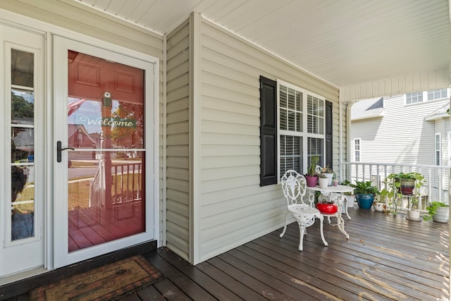 entrance to property featuring a porch