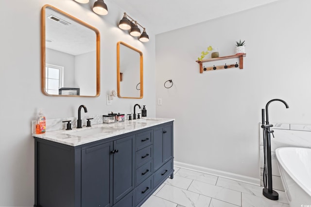 bathroom featuring a tub and vanity