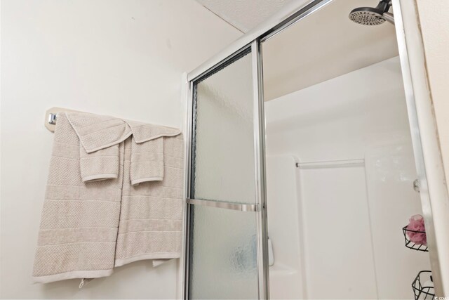 bathroom featuring an enclosed shower