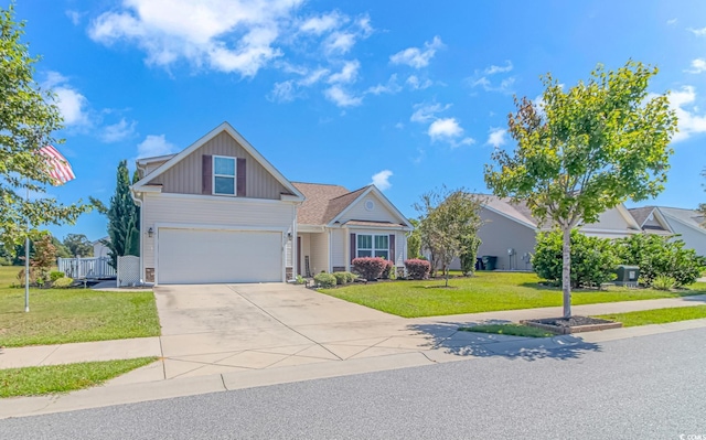 view of front of property with a garage and a front yard