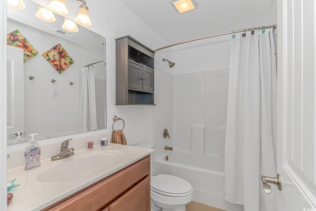 full bathroom featuring vanity, toilet, and shower / tub combo