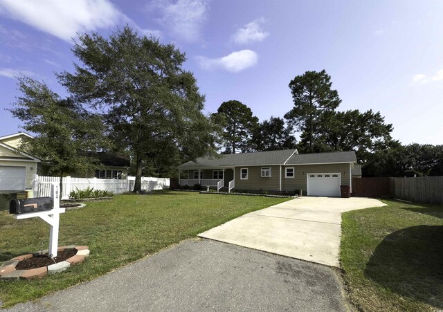 ranch-style house with a garage and a front yard