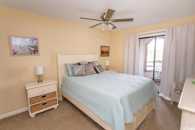 carpeted bedroom featuring ceiling fan and access to exterior