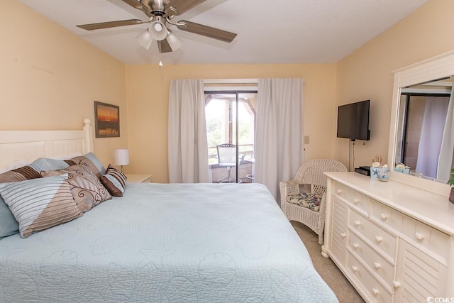 bedroom with ceiling fan, access to exterior, and carpet floors