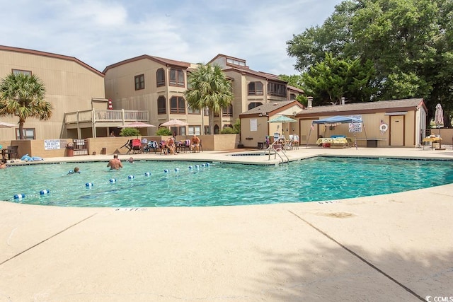 view of swimming pool with a patio