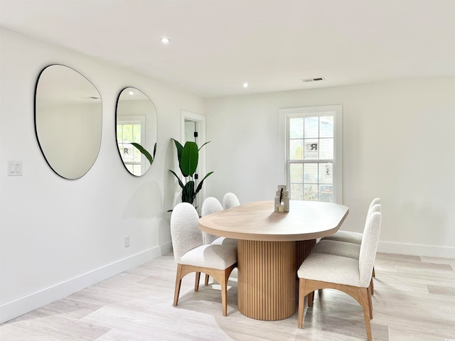 dining space featuring light hardwood / wood-style flooring