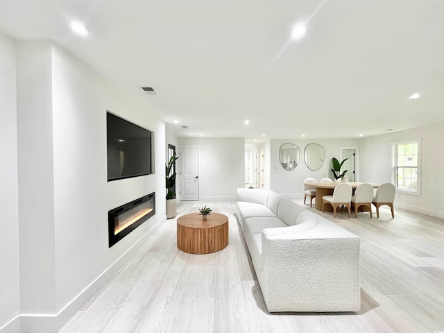 living room with light hardwood / wood-style floors