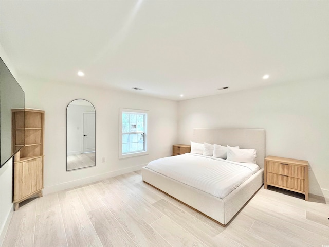 bedroom with light wood-type flooring