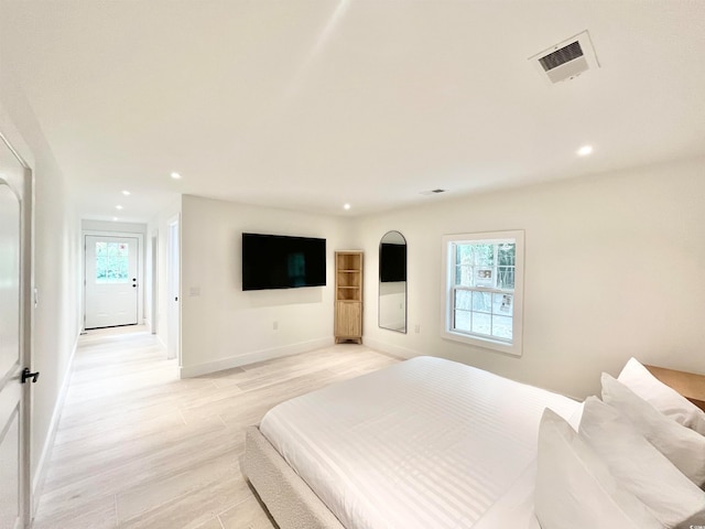 bedroom with light hardwood / wood-style flooring