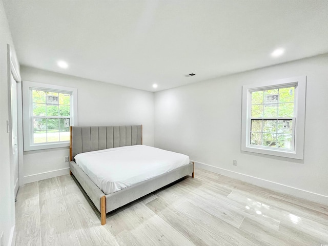 bedroom with light hardwood / wood-style floors