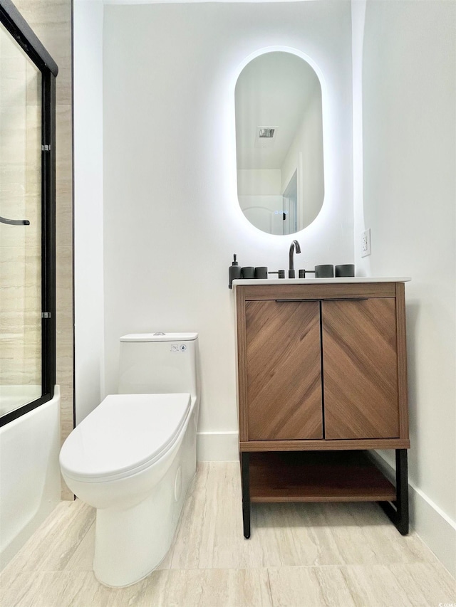 full bathroom with vanity, toilet, and bath / shower combo with glass door