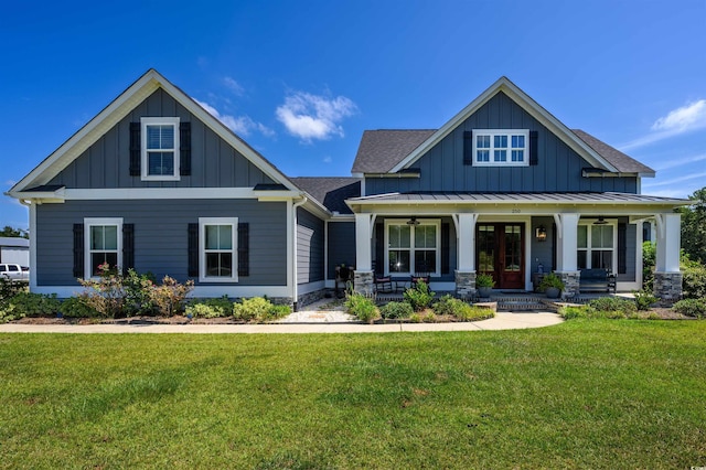 craftsman-style house featuring a porch and a front lawn