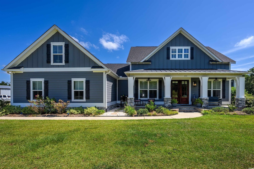 craftsman-style house featuring a porch and a front lawn