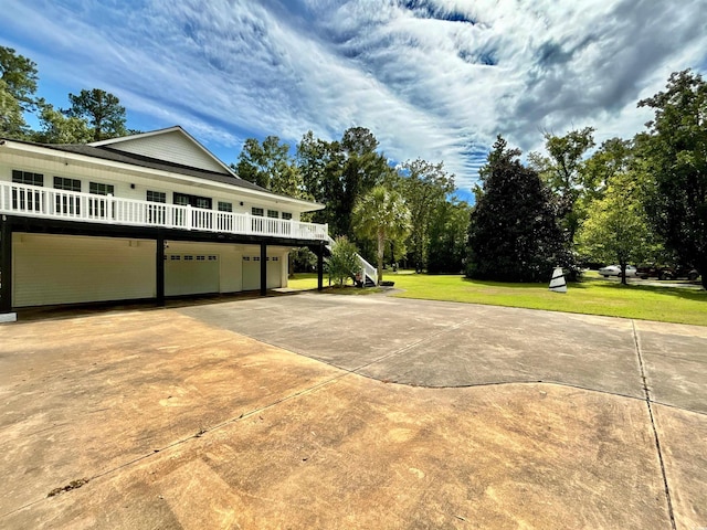 view of basketball court featuring a lawn