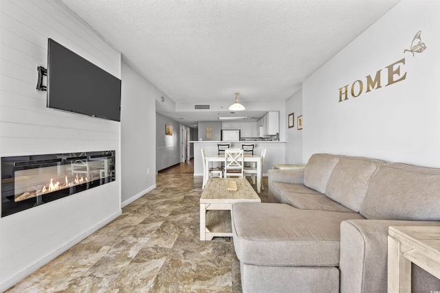 living room with a textured ceiling