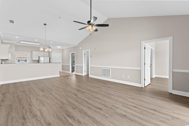 124 S Shore Blvd Unit 303, Longs, SC 29568 - unfurnished living room featuring ceiling fan, light wood-style floors, high vaulted ceiling, a chandelier, and recessed lighting