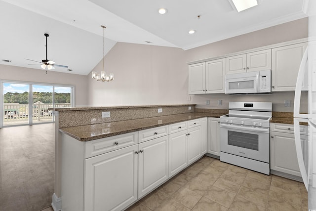 kitchen with ceiling fan with notable chandelier, white appliances, white cabinetry, and lofted ceiling