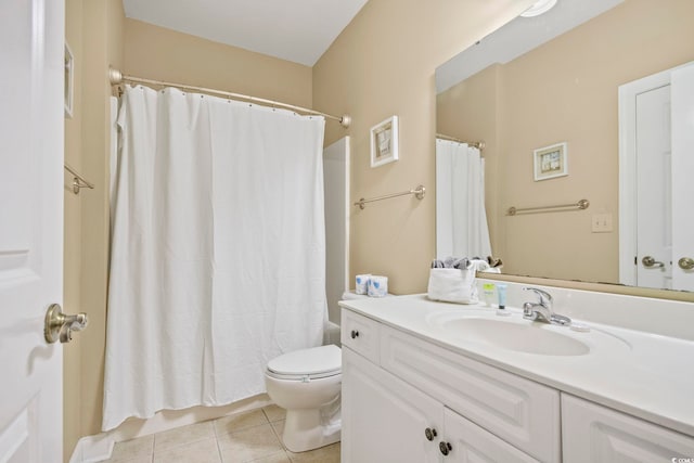 bathroom featuring vanity, toilet, tile patterned floors, and walk in shower