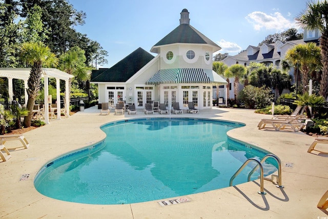 view of pool featuring a pergola and a patio area