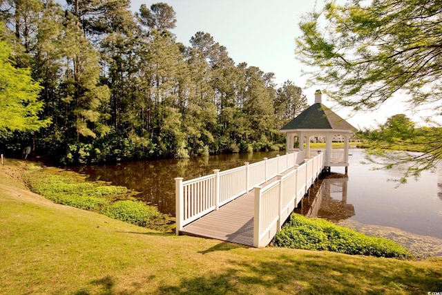 view of dock featuring a water view, a yard, and a gazebo