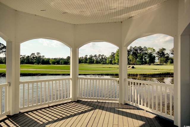 deck featuring a water view and a yard