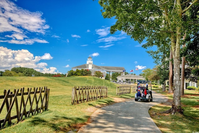 surrounding community featuring a lawn