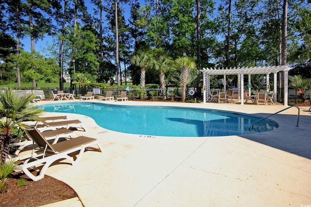 view of swimming pool with a pergola and a patio area