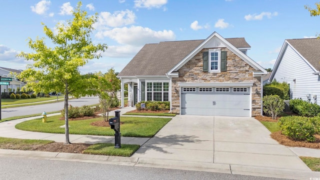 view of front facade with a front yard and a garage