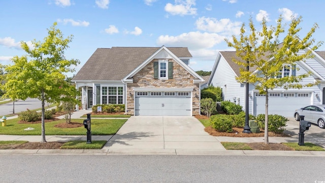 view of front of house featuring a garage and a front lawn