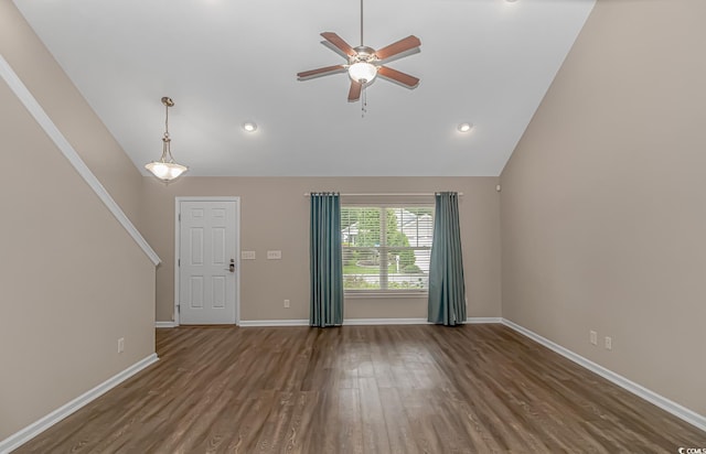 unfurnished living room with dark hardwood / wood-style flooring, high vaulted ceiling, and ceiling fan