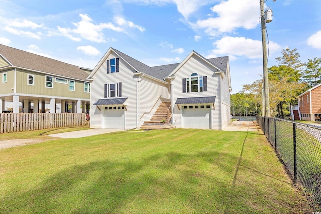 view of front of house with a front lawn and a garage